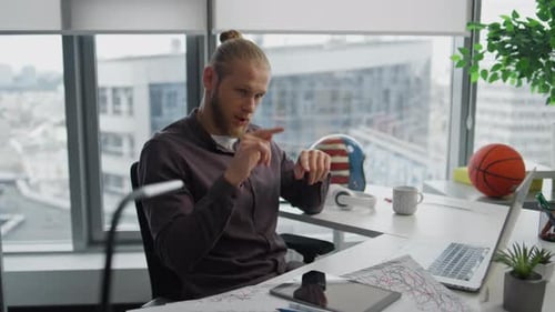 Focused Teacher Explaining Video Call at Office Closeup