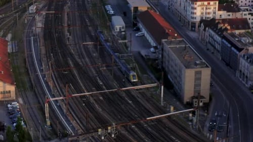 Drone tracking detail shot train on tracks entering station Stock HD 30p