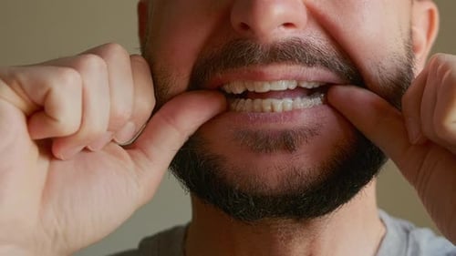 Man Removes Dental Aligners