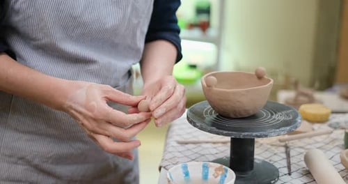 Woman Forming Clay Pot Shape By Hands Closeup in Artistic Studio