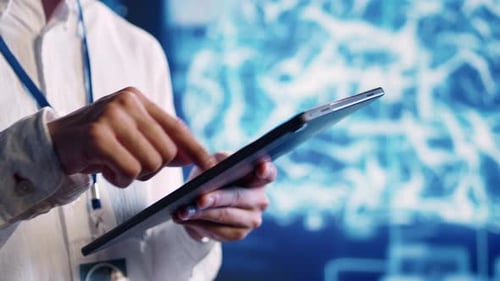Specialist Doing AI Simulation on Tablet