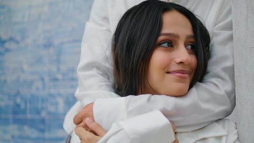 Affectionate Couple Embracing Tenderly in White Shirts