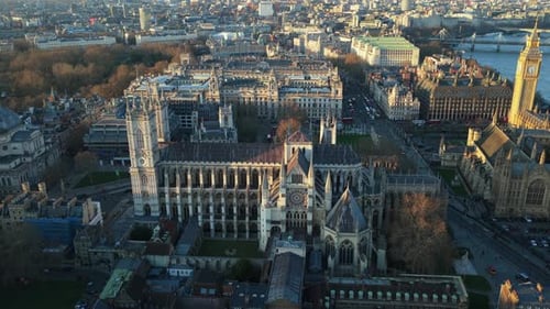 Aerial Orbit of Westminster Abbey Revealing Houses of Parliament Big Ben and River Thames in