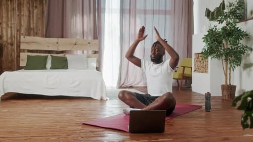 Man Practicing Yoga in Sunny Apartment