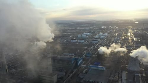 Aerial View of Thermal Power Plant Drone Flies Over Chimney Smoke Pipes and Cooling Towers of