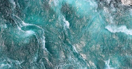 Blue waves of water of the river and the sea meet each other during high tide and low tide.