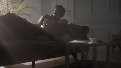 Woman and Child Embracing Gently Indoors