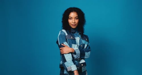 Face, woman and confident for fashion in studio of casual clothes, positive attitude