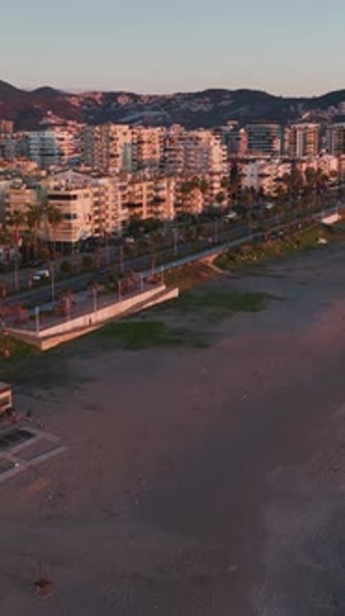 Vertical Video Magical Sunset Over the Calm Sea with Sun Rays Reflecting Brightly on the Water