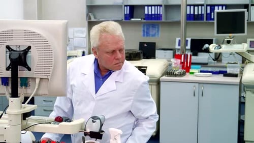 Scientist Working in a Bright Laboratory