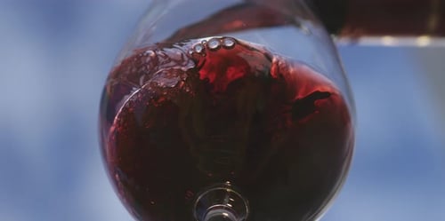 Pouring Red Wine into Glass in Close Up