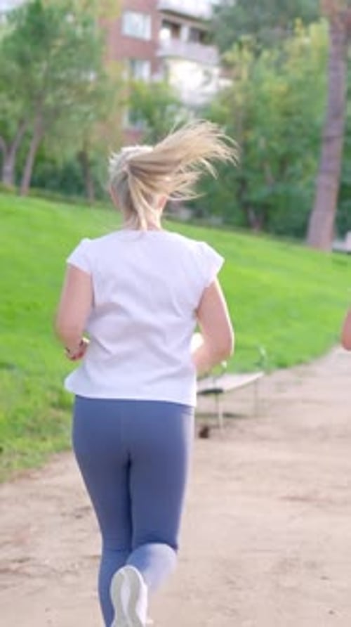 Senior Couple Running in the Park for a Healthy Lifestyle