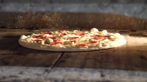 Pepperoni Pizza Baking in Brick Oven
