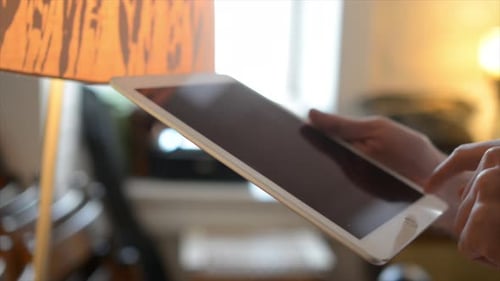 Side View of hand Using Tablet