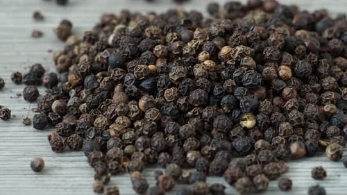 Peppercorns from a black pepper plant (Piper nigrum)