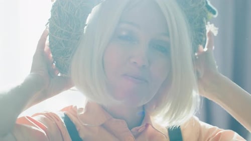Smiling Woman Wearing a Twig Headpiece, Close Up