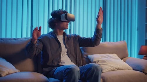 Young Adult Using Virtual Reality Headset at Home