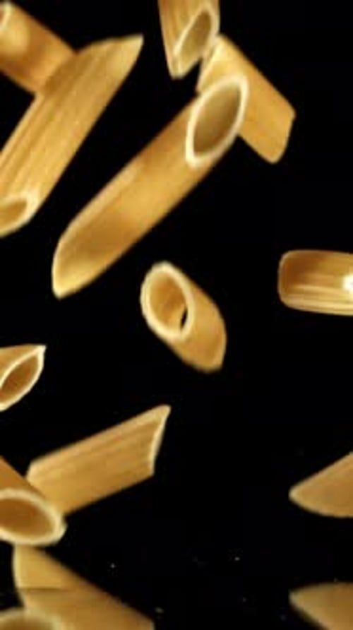 Super Slow Motion Dry Penne Pasta Filmed on a Highspeed Camera at 1000 Fps