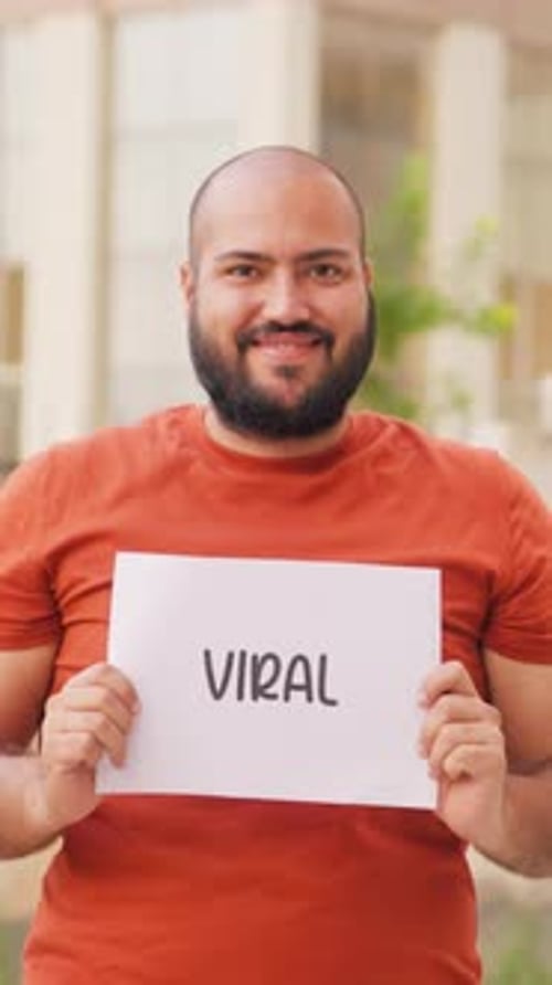 Man Holding Viral Sign Outdoor
