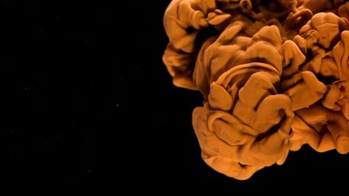 Orange Ink in Water on a Black Background Filmed on a Highspeed Camera at 1000 Fps