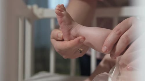 Gentle Hands Massage Adorable Infant's Foot