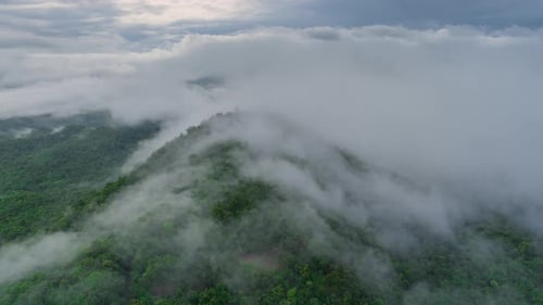 Mist flowing over the summit Above is a telecommunications station.