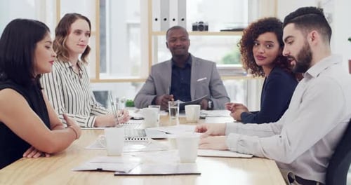 Diverse Team Discussing Business in Modern Office