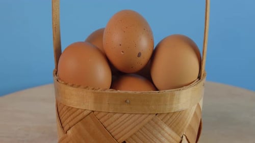 Close Up Eggs in Small Woven Basket