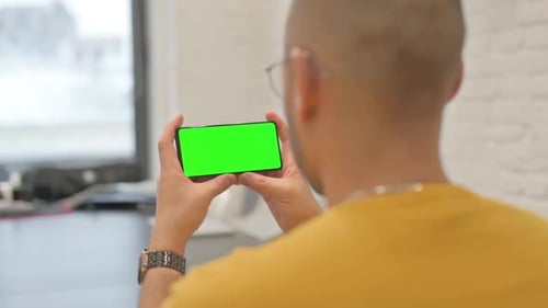Holding Phone Horizontal with Green Screen