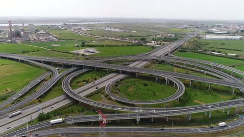 Road traffic with cars in movement on street, top down view, auto junction