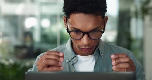 Man, laptop and glasses in office for journalist, press employee and online for publishing news