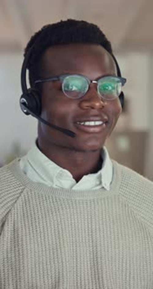 Black person, call center and microphone with face for technical support as professional