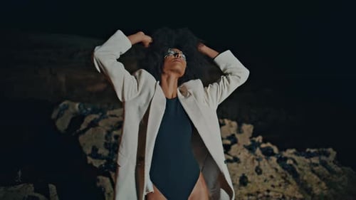 Fashion Girl Modeling Beach in Swimsuit Jacket at Night Attractive Woman Dance