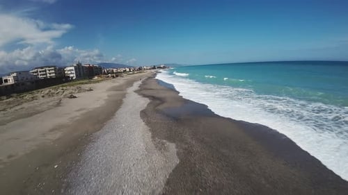 Ocean Waves Crashing Into Sandy Beach