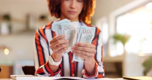 Woman, hands and counting money with notes for financial planning or expenses at home