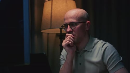 Man Stock Trader in Home Office Male Analyzes Terminal Trades Stocks on Crypto Market Candlestick