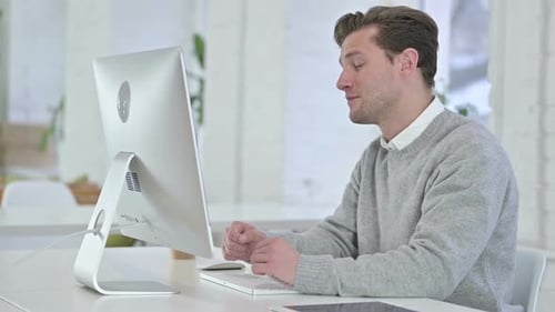 Man Working on Computer, Having Video Conference Call