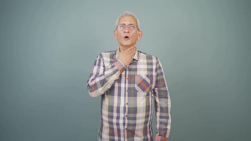 Man Experiencing Throat Pain in Mid Shot