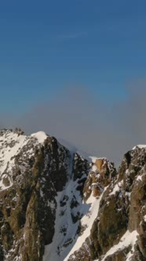 Snow Capped Mountain Peaks Under Blue Sky. British Columbia, Canada.
