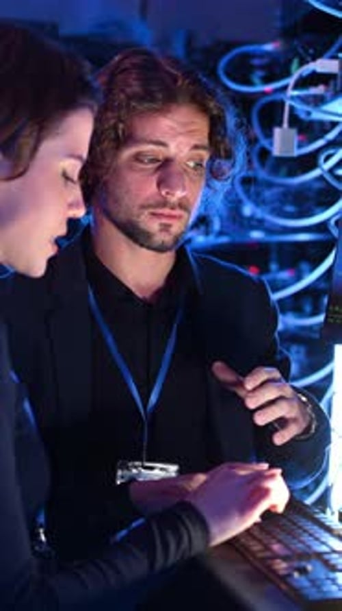 Two Young Adults in Computer Server Room