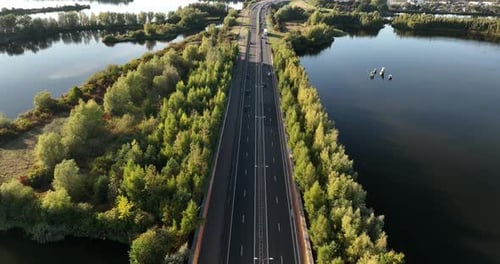 Transportation and roads. Aerial view. The road through the woods. Video background.