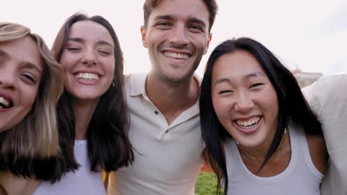 Smiling Young Adults Gathered Together Outdoors