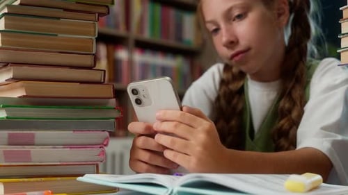 Little Caucasian School Child Kid Girl Suffering Boring Using Mobile Phone Application Online