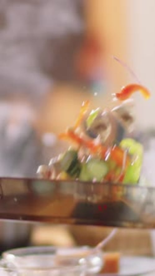 Close-up of Unrecognizable Person Tossing Vegetables in Pan