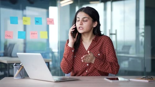 Woman Talking on Phone in Modern Office