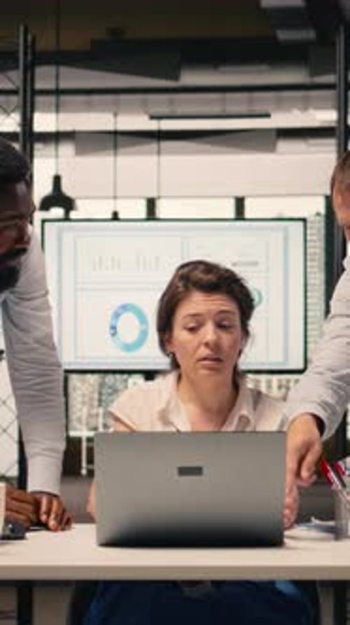 Vertical Video Professional Team Analyzing Income Data Taxes and Compliance Reports