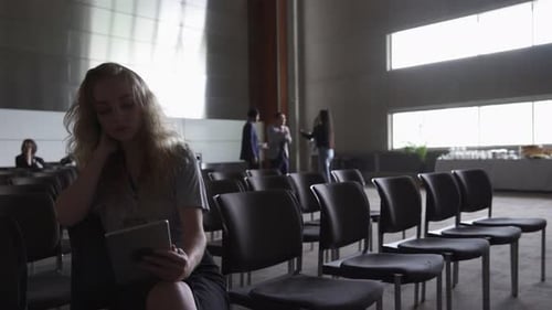 Businesswoman Using Digital Tablet Waiting in Conference Audience 2024 Years
