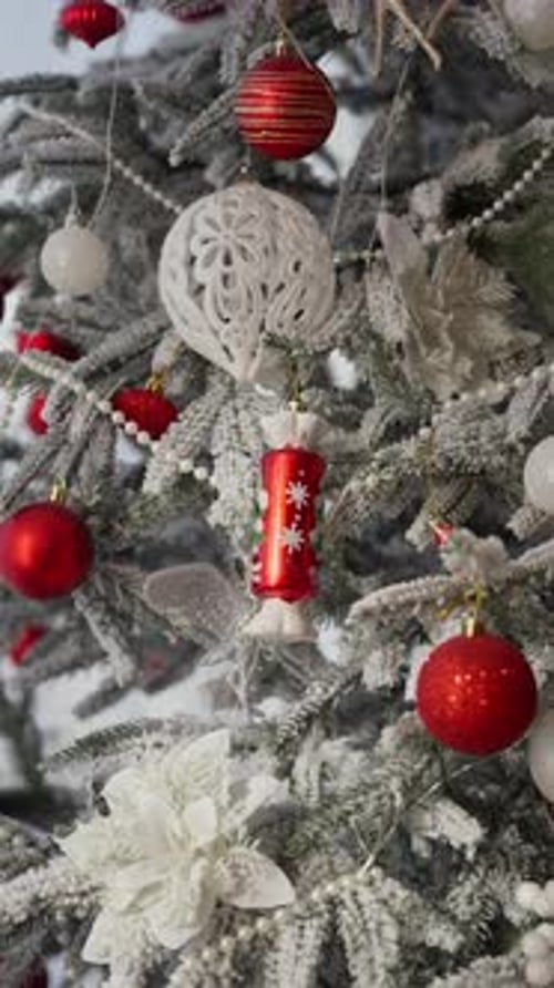 Toys and Garlands Hang on the Branches of the Christmas Tree