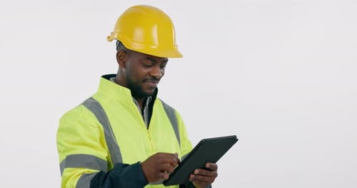 Construction worker, man and smile with tablet in studio for project management
