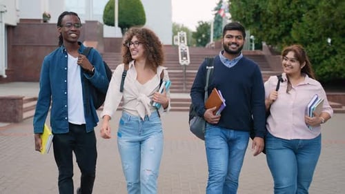 Diverse Group of University Students Walking and Talking on Campus